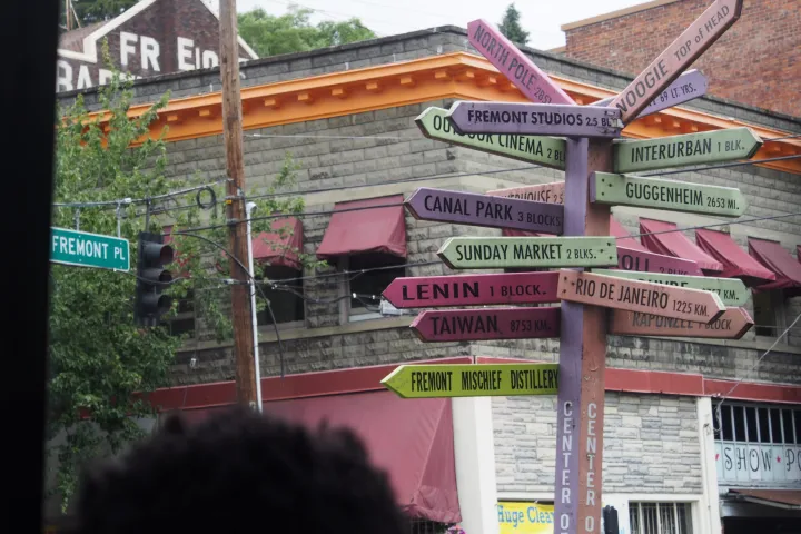 a bunch of signs pointing in different directions