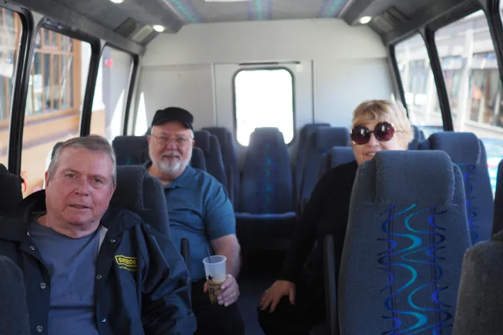 Harry Simmons et al. posing for the camera on a seattle bus tour