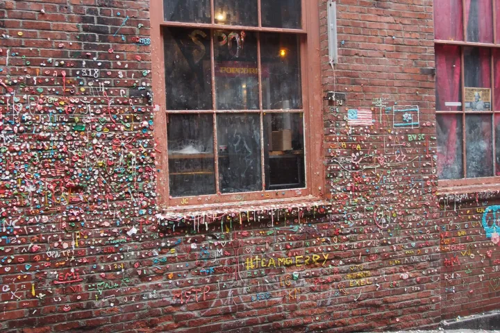 a brick wall covered in gum