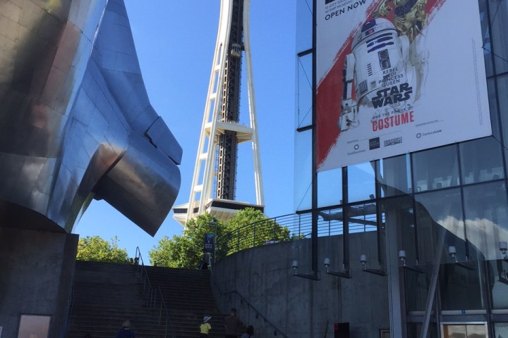 a car parked in front of the Space Needle