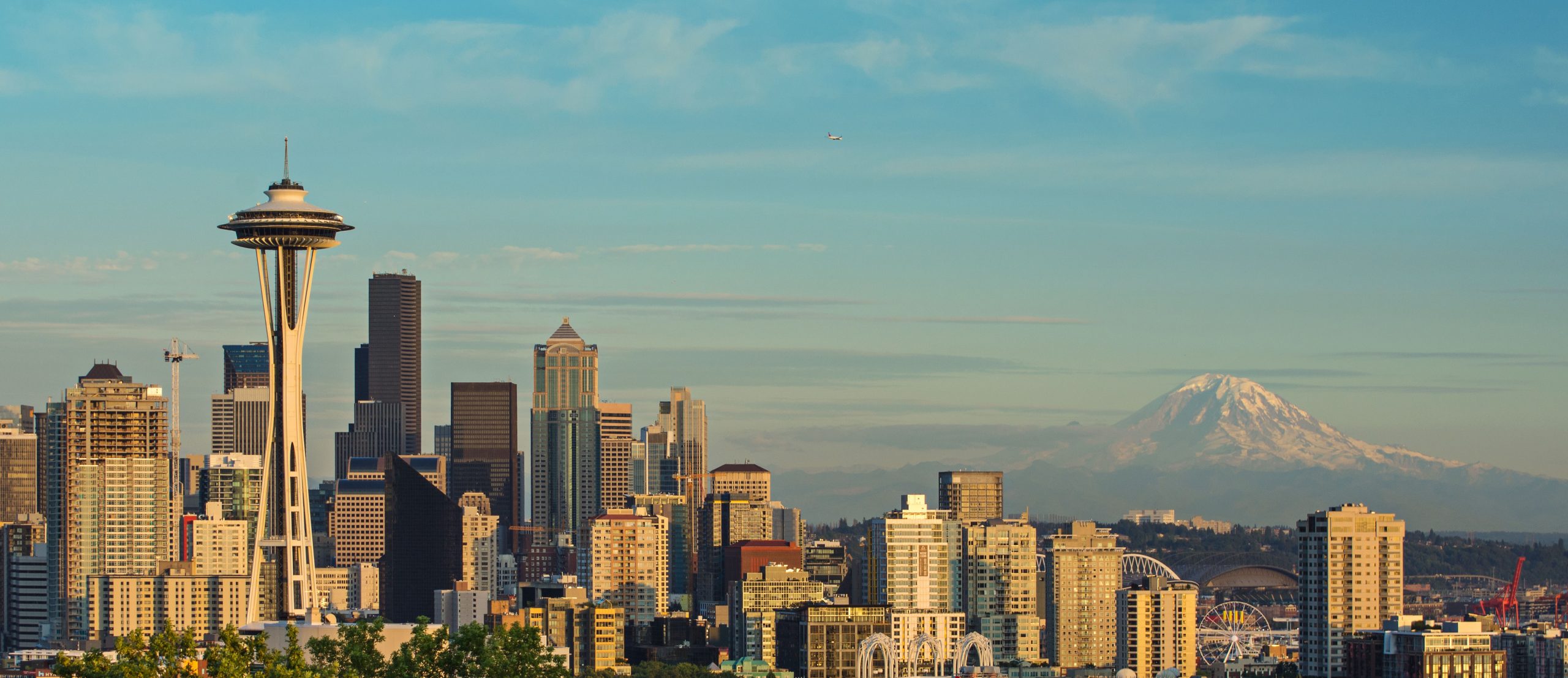 Aerial view of Space Needle with Columbia Center and Smith Tower amidst the dense urban landscape