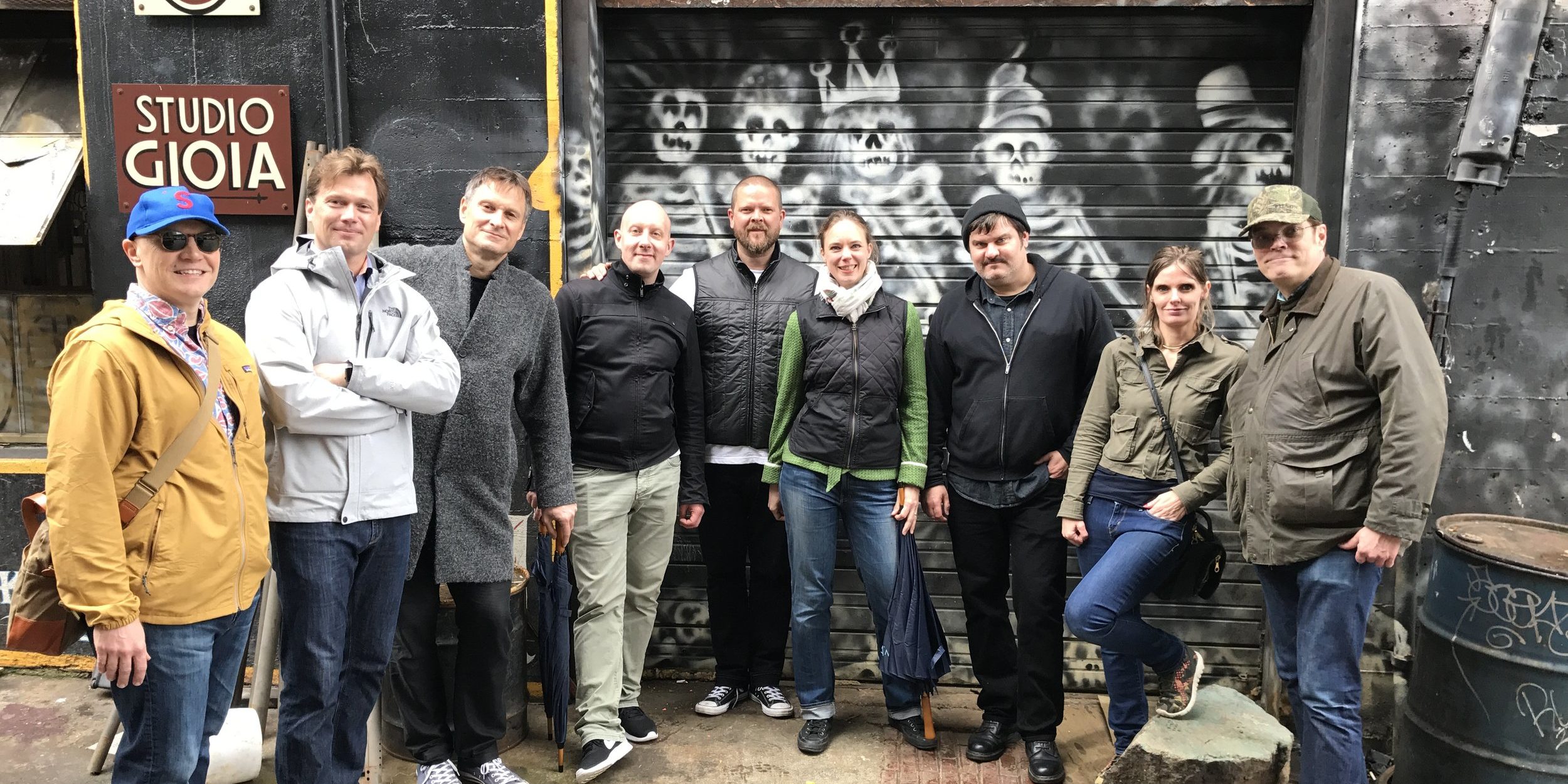 Claus Meyer et al. standing in front of a building